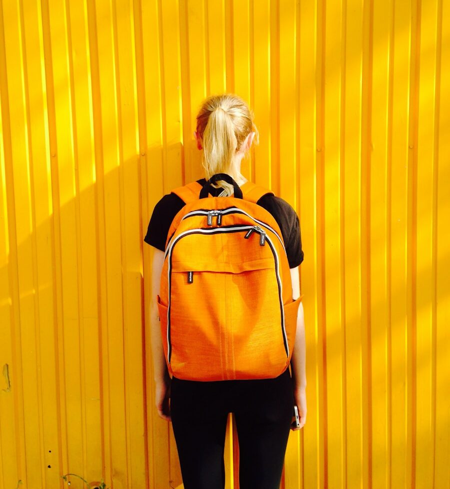 photo of woman facing yellow wall
