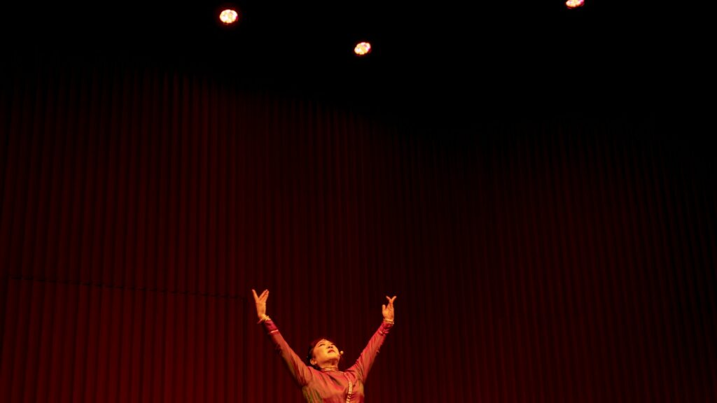 a man and woman on stage